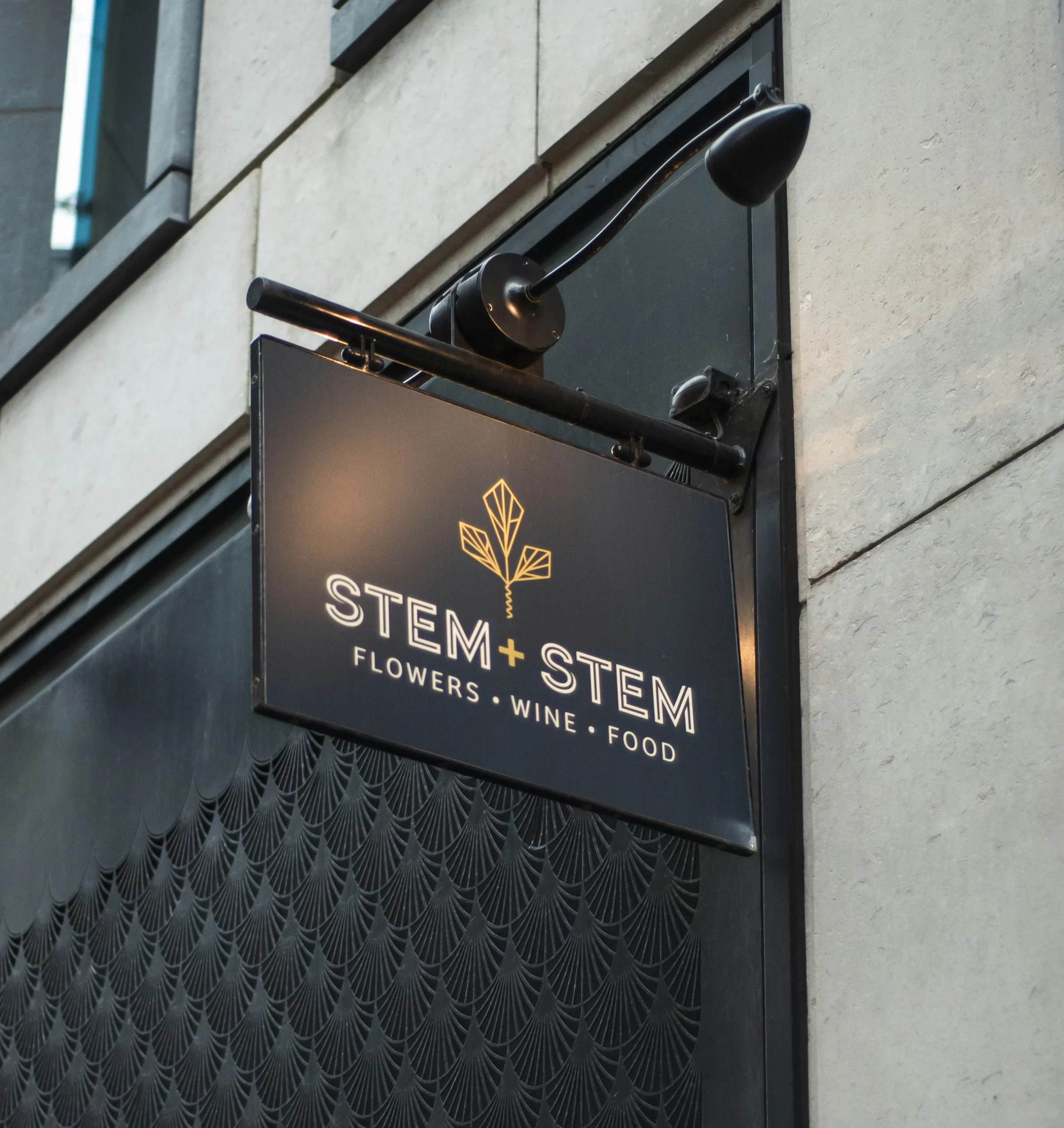 Exterior sign for Stem + Stem, flowers, wine and food