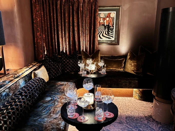 Luxury lounge with wine glasses and ice buckets on tables