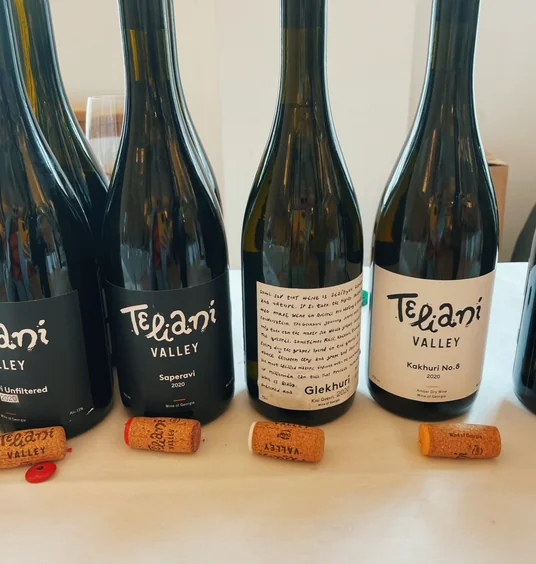 Teiani Valley wine bottles displayed with corks on a table
