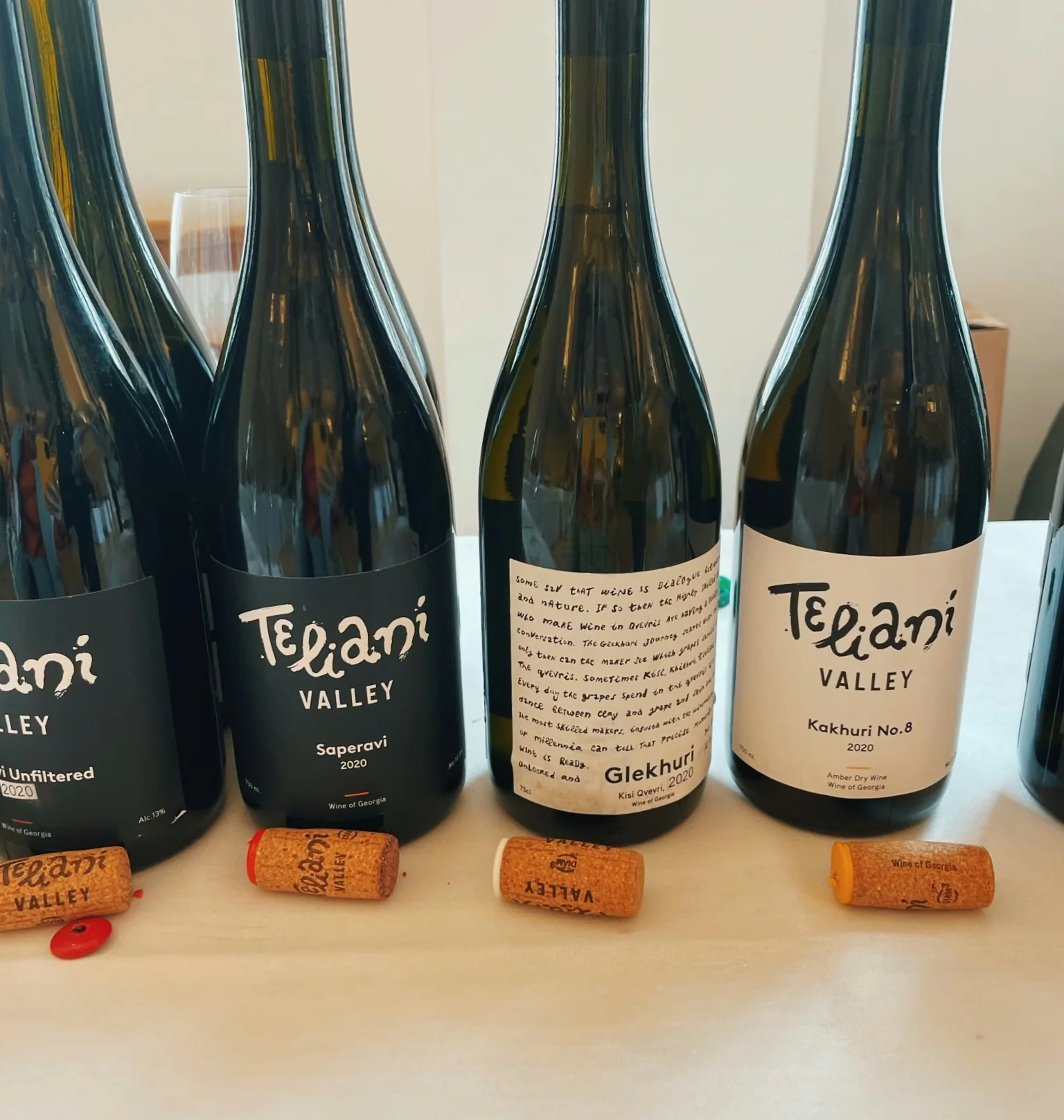 Teiani Valley wine bottles displayed with corks on a table