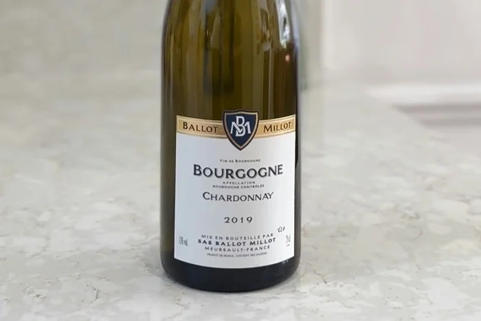 Bourgogne Chardonnay wine bottle on marble countertop