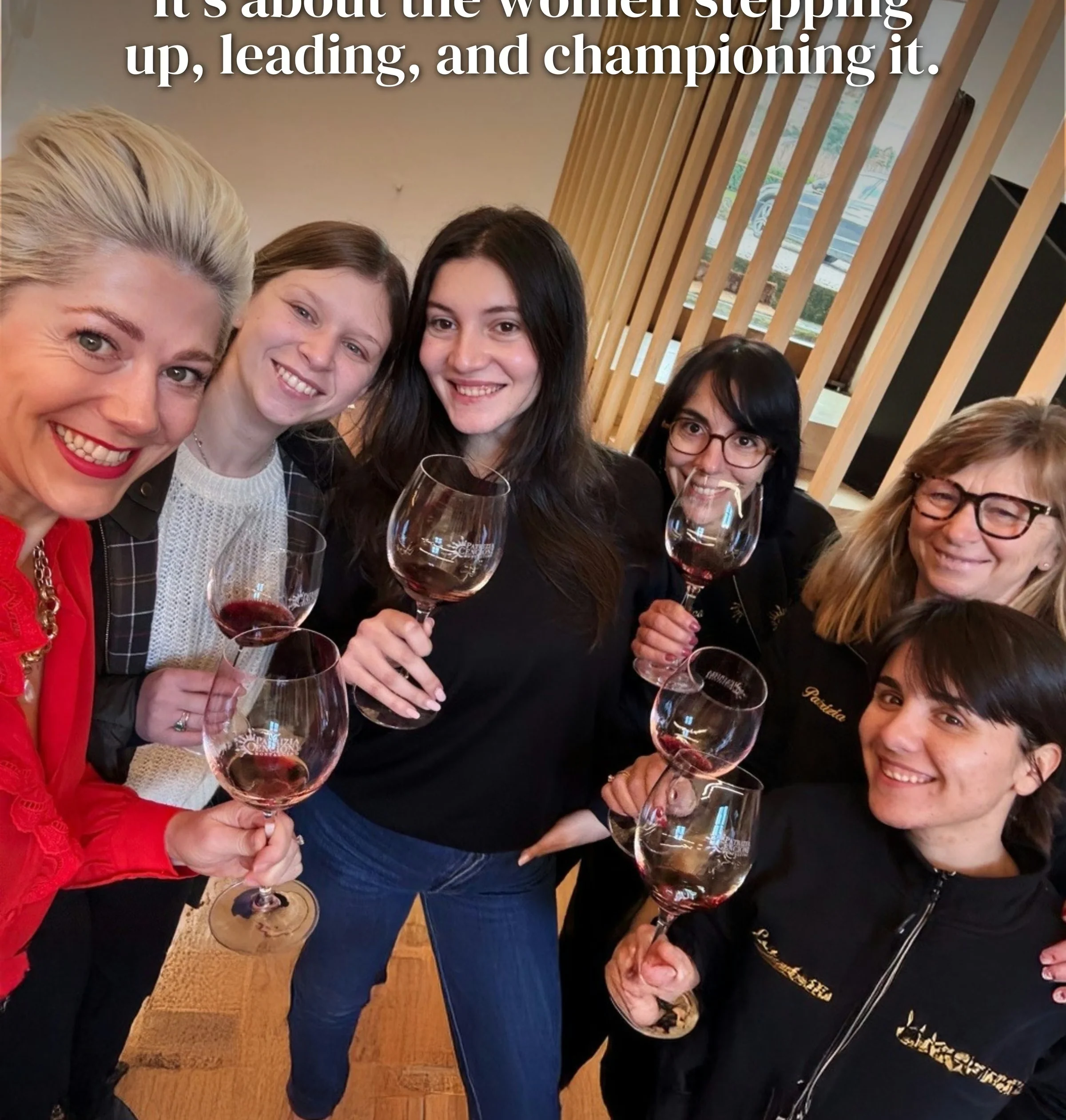 Group of women smiling and holding wine glasses beneath text about women leading and championing wine