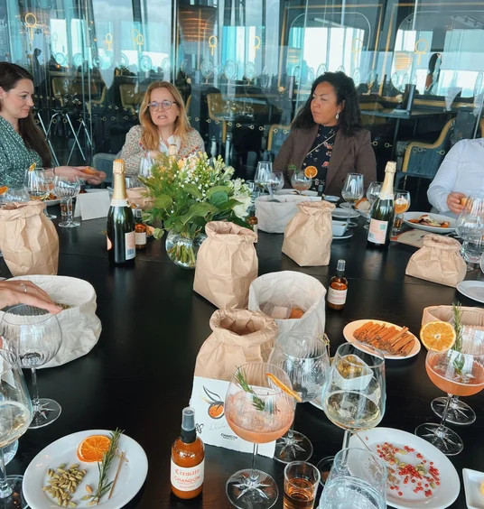 Guests enjoy Chandon drinks and food at a stylish restaurant table