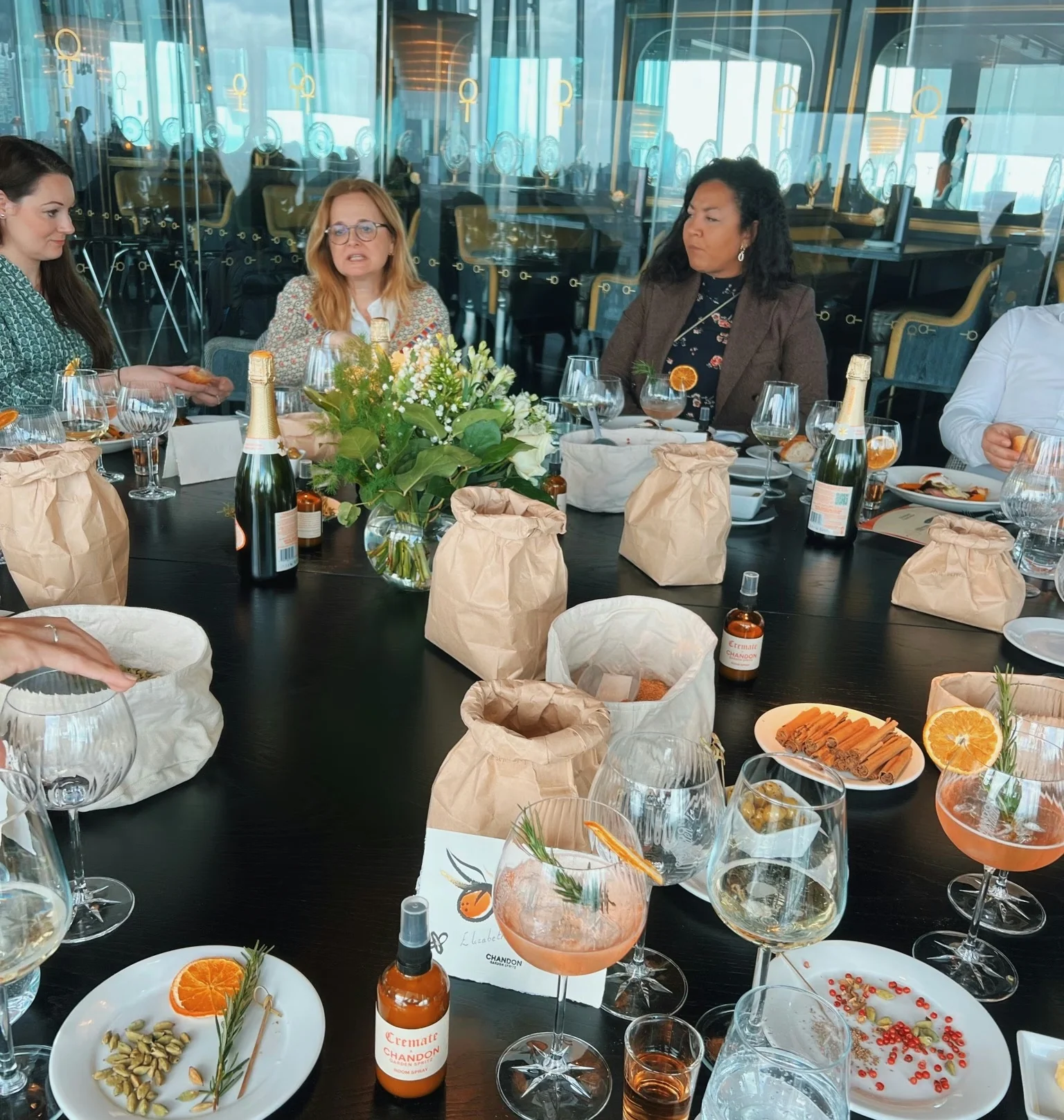 Guests enjoy Chandon drinks and food at a stylish restaurant table