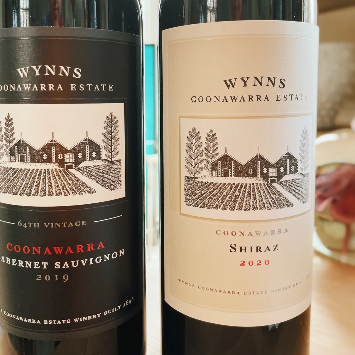 Two Wynns Coonawarra Estate wine bottles, Cabernet Sauvignon and Shiraz labels