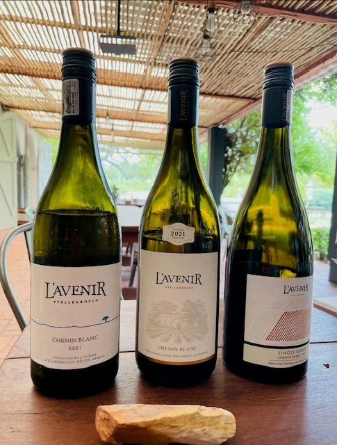 Three Lavenir Chenin Blanc wine bottles on a table