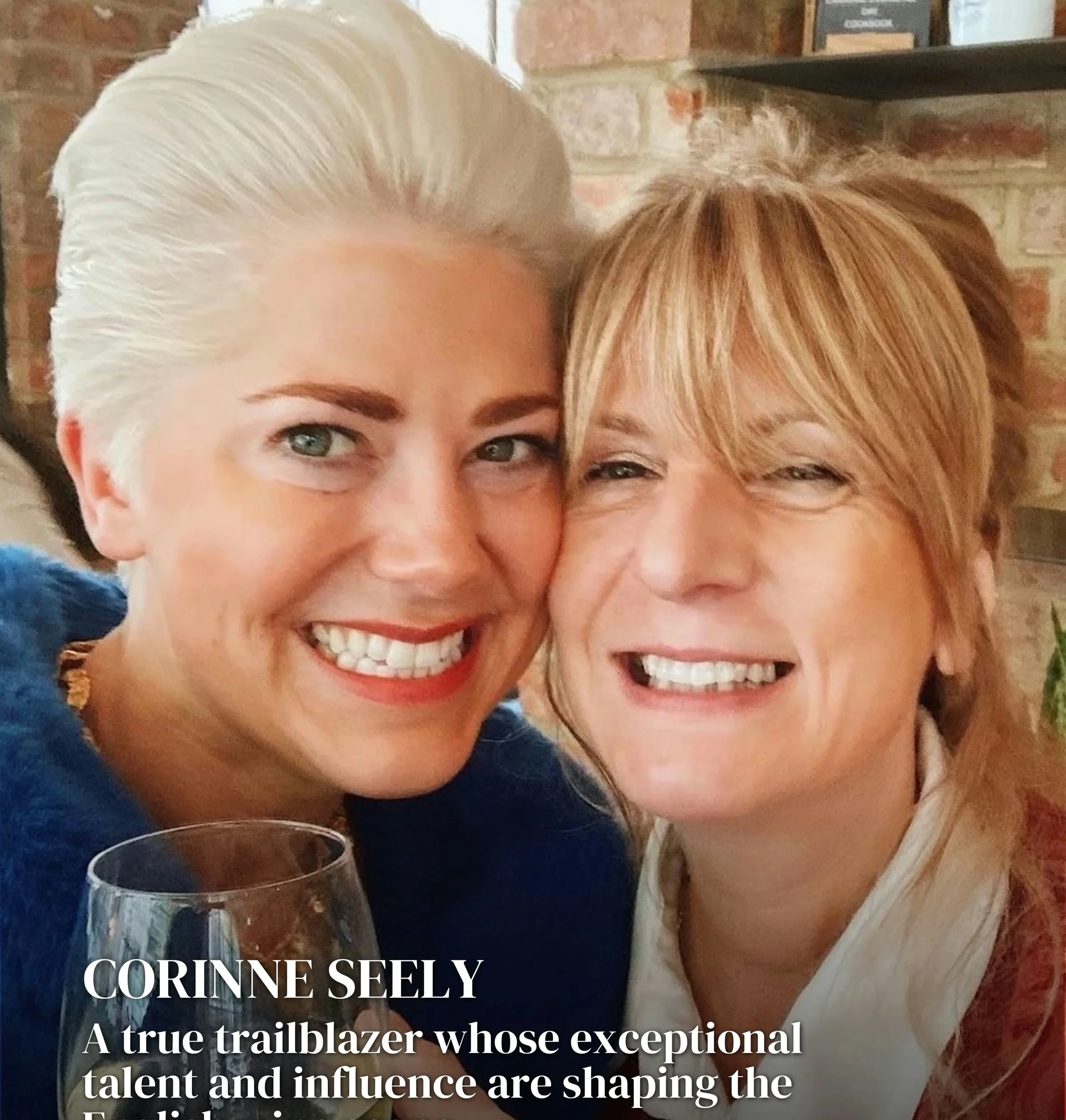 Two women smiling together indoors, with a wine glass and an English wine caption