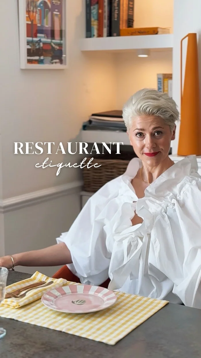Woman seated at restaurant table, with text Restaurant etiquette