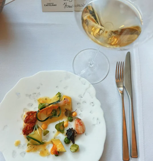 Champagne Castelnau wine served with a plated tasting dish