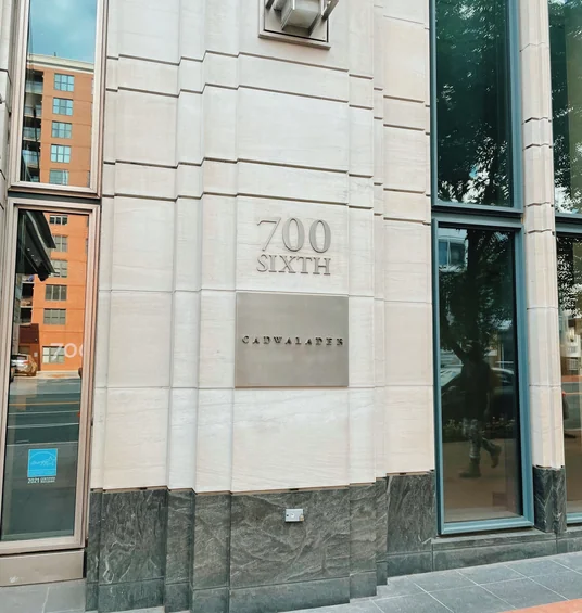 Exterior of 700 Sixth, Cadwalader, with a stone facade and tall windows