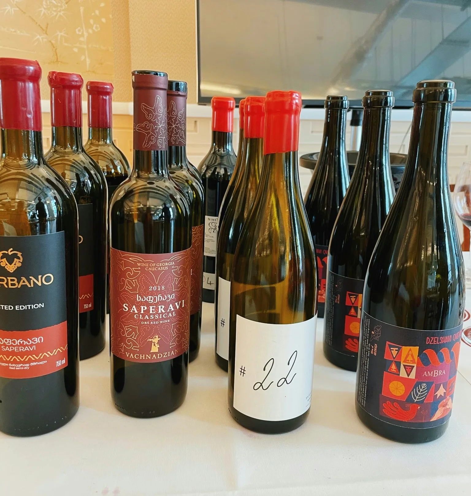 Collection of Georgian wine bottles arranged on a table