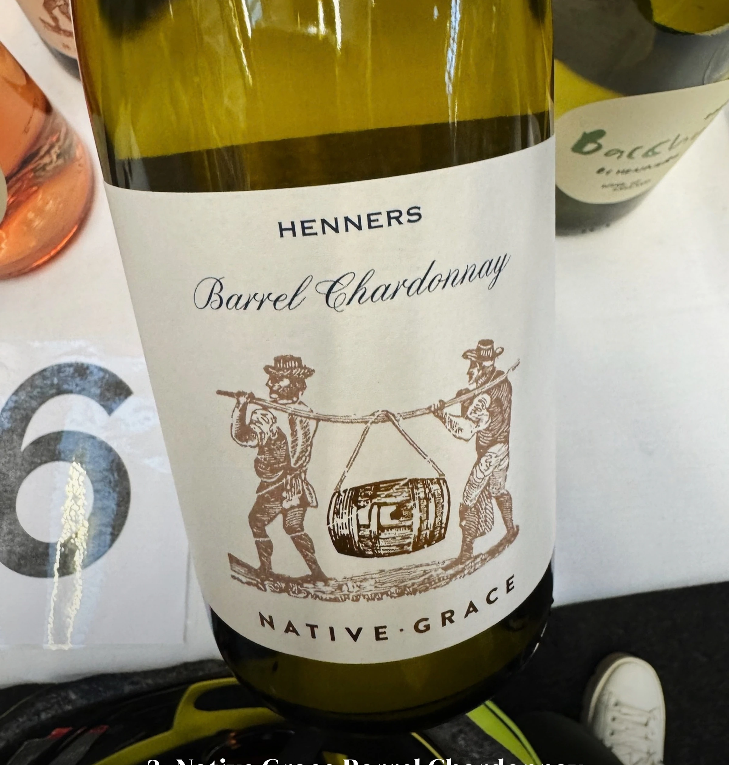 Henners Native Grace Barrel Chardonnay bottle, with text naming Henners Vineyard in East Sussex