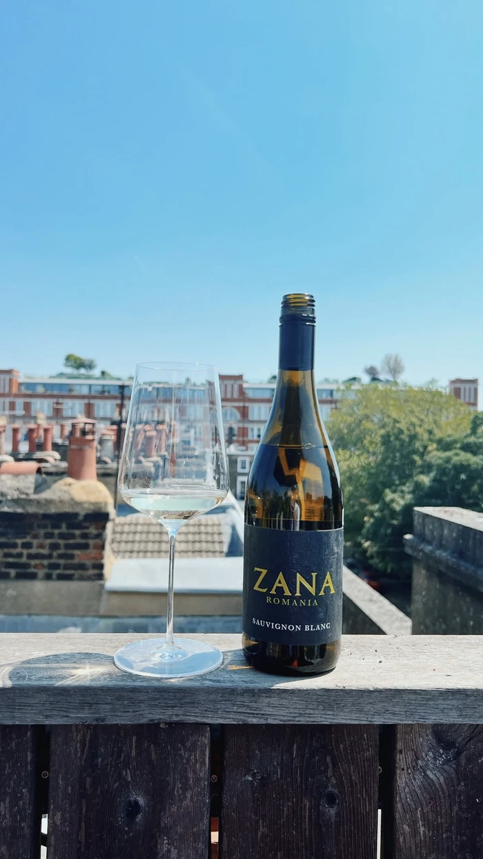 Zana Sauvignon Blanc bottle and filled wine glass on a London rooftop