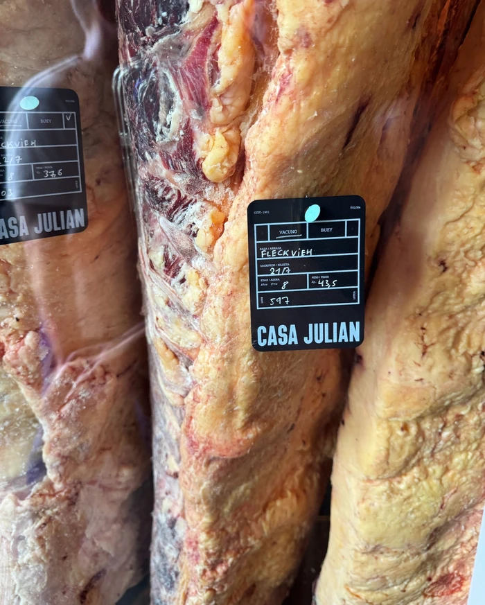Hanging beef sides with Casa Julian identification tags