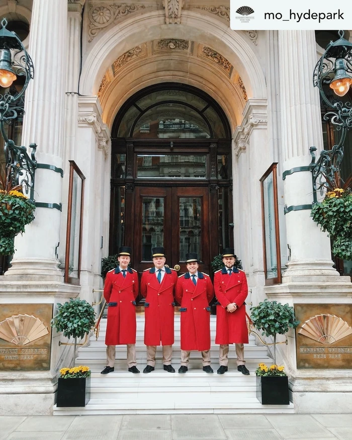 Four doormen in red coats outside the Mandarin Oriental Hyde Park entrance