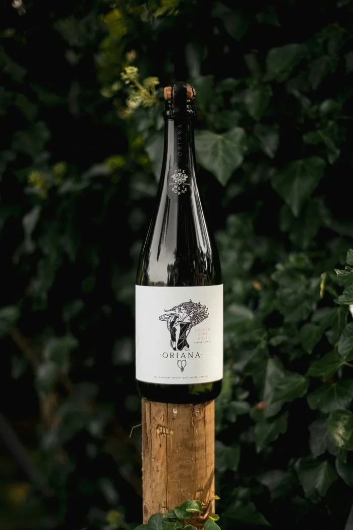 Oriana Golden Spur Brut bottle displayed against leafy greenery