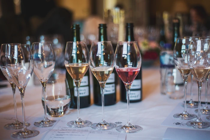 Wine tasting table with glasses of white, rosé and red wine