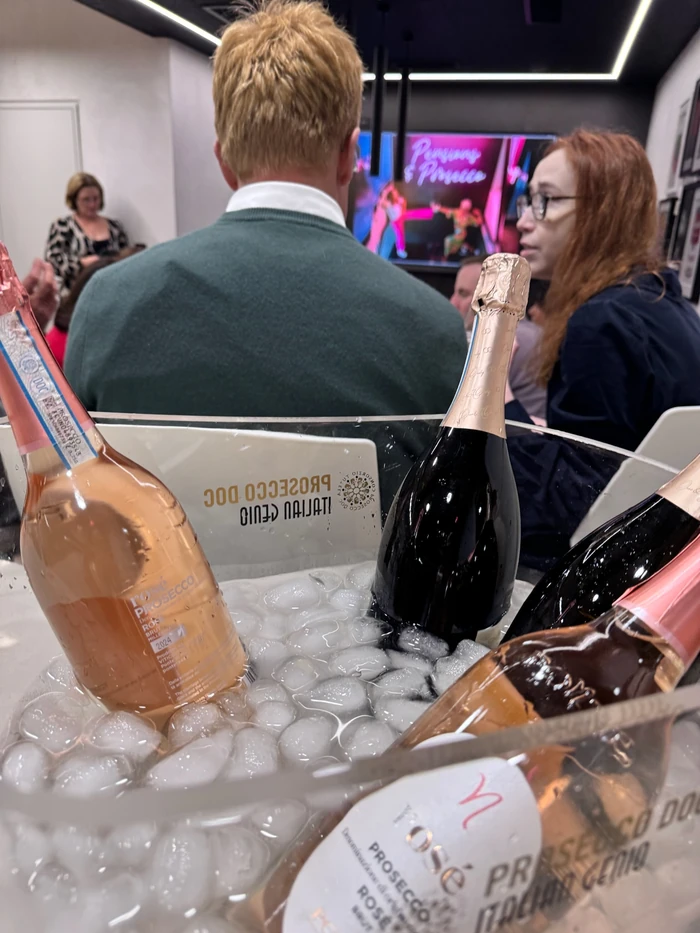 Prosecco bottles chilling in ice at a Pensions & Prosecco tasting