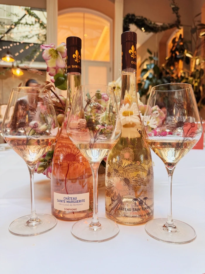 Château Sainte Marguerite rosé wines and floral wine glasses on a decorated table