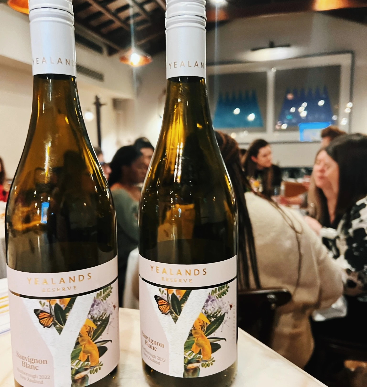 Two Yealands Reserve Sauvignon Blanc bottles on a table at a wine tasting