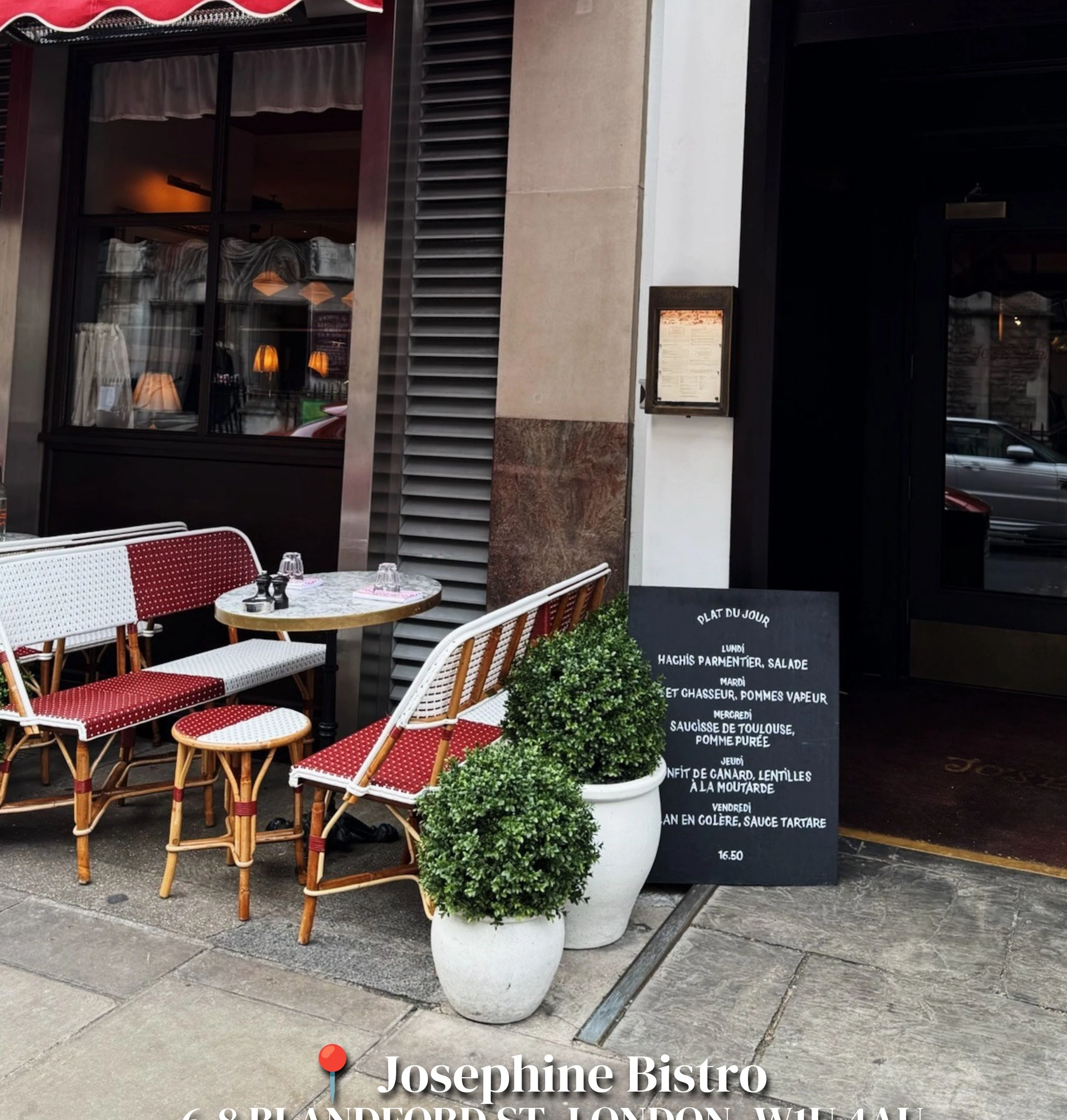Josephine Bistro exterior with red awnings, outdoor seating and a French daily specials board