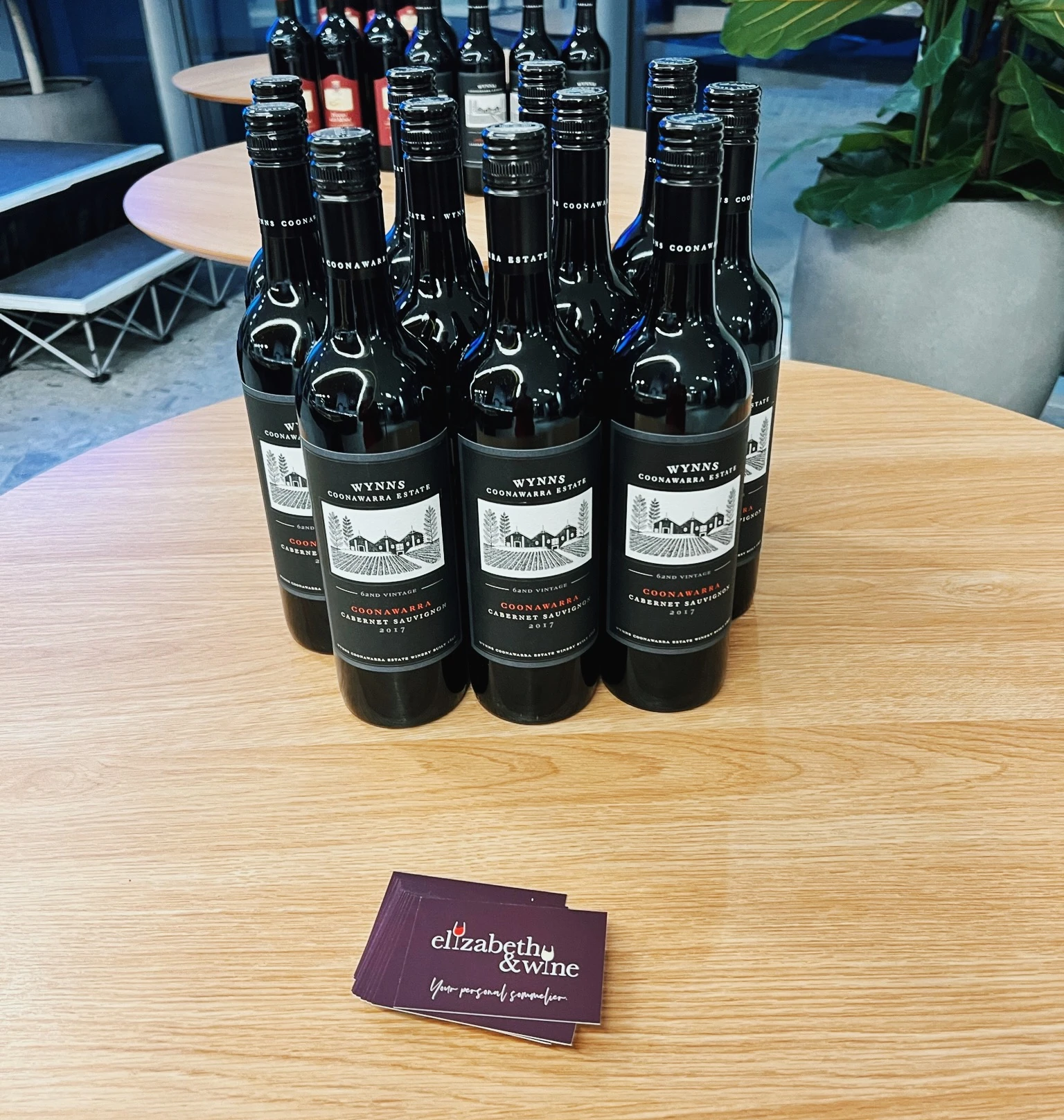 Bottles of Wynns Coonawarra Estate Cabernet Sauvignon arranged on a table with Elizabeth & Wine cards