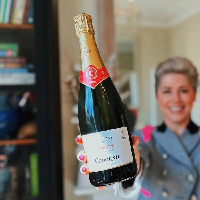 Woman holding a bottle of Codorníu Cava