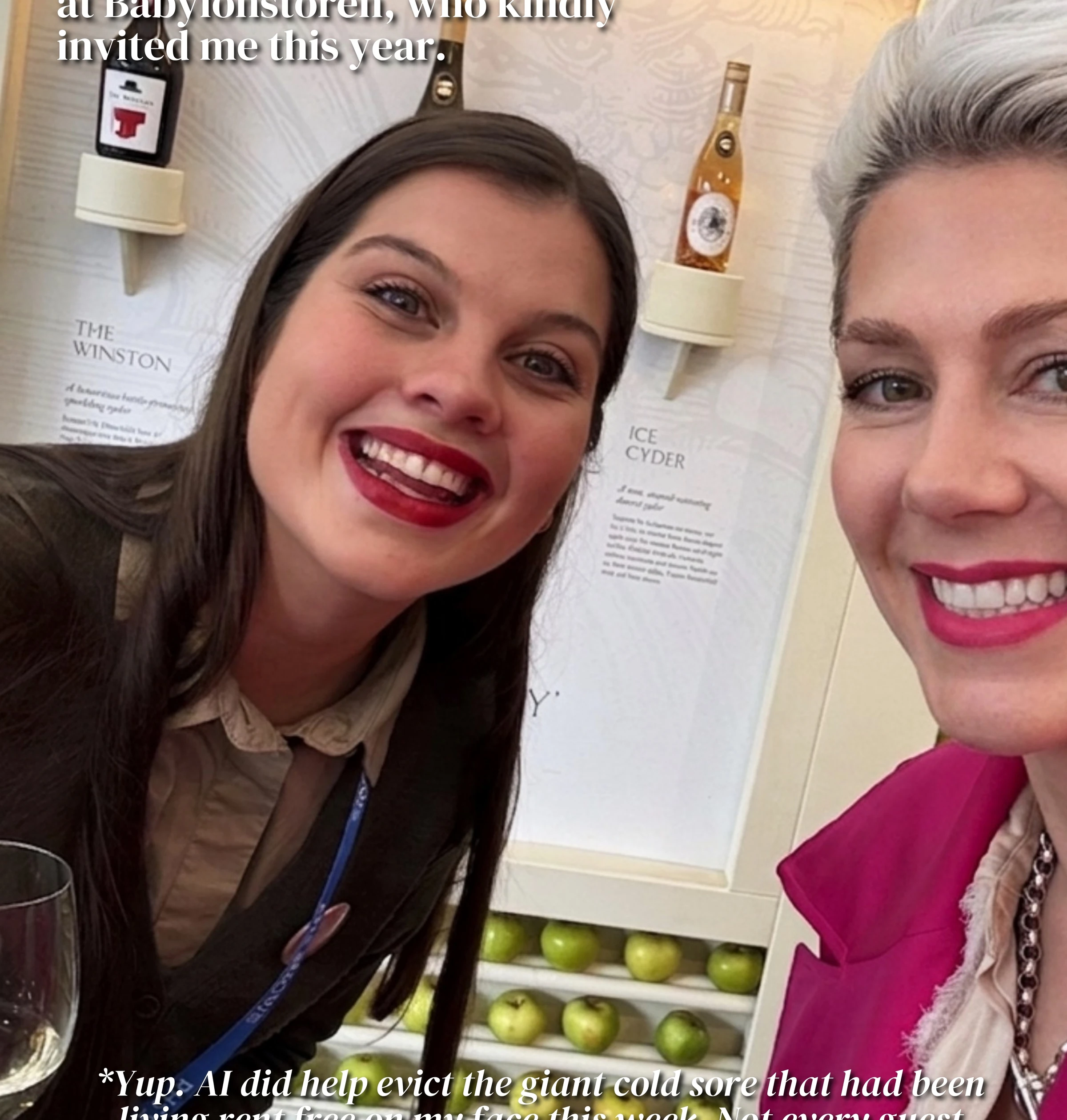 Two smiling women pose beside an ice cider display at the Chelsea Flower Show