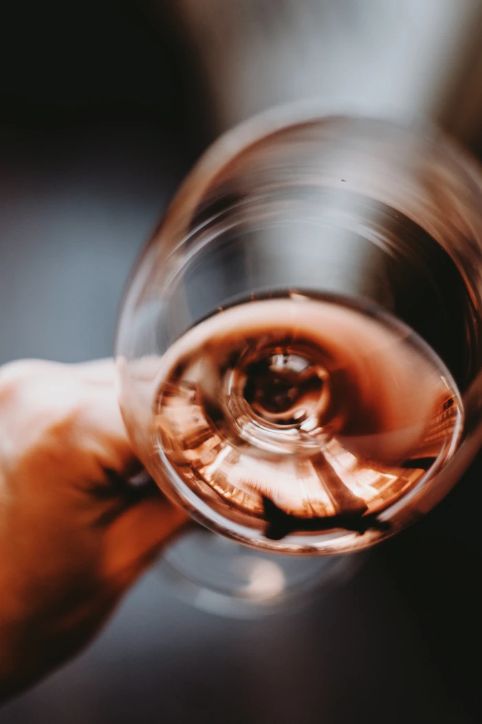 Close-up of rosé wine swirling in a glass