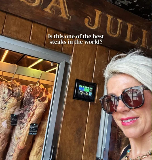 Elizabeth Hawthornthwaite beside a display of aged steaks at Casa Julián Tolosa
