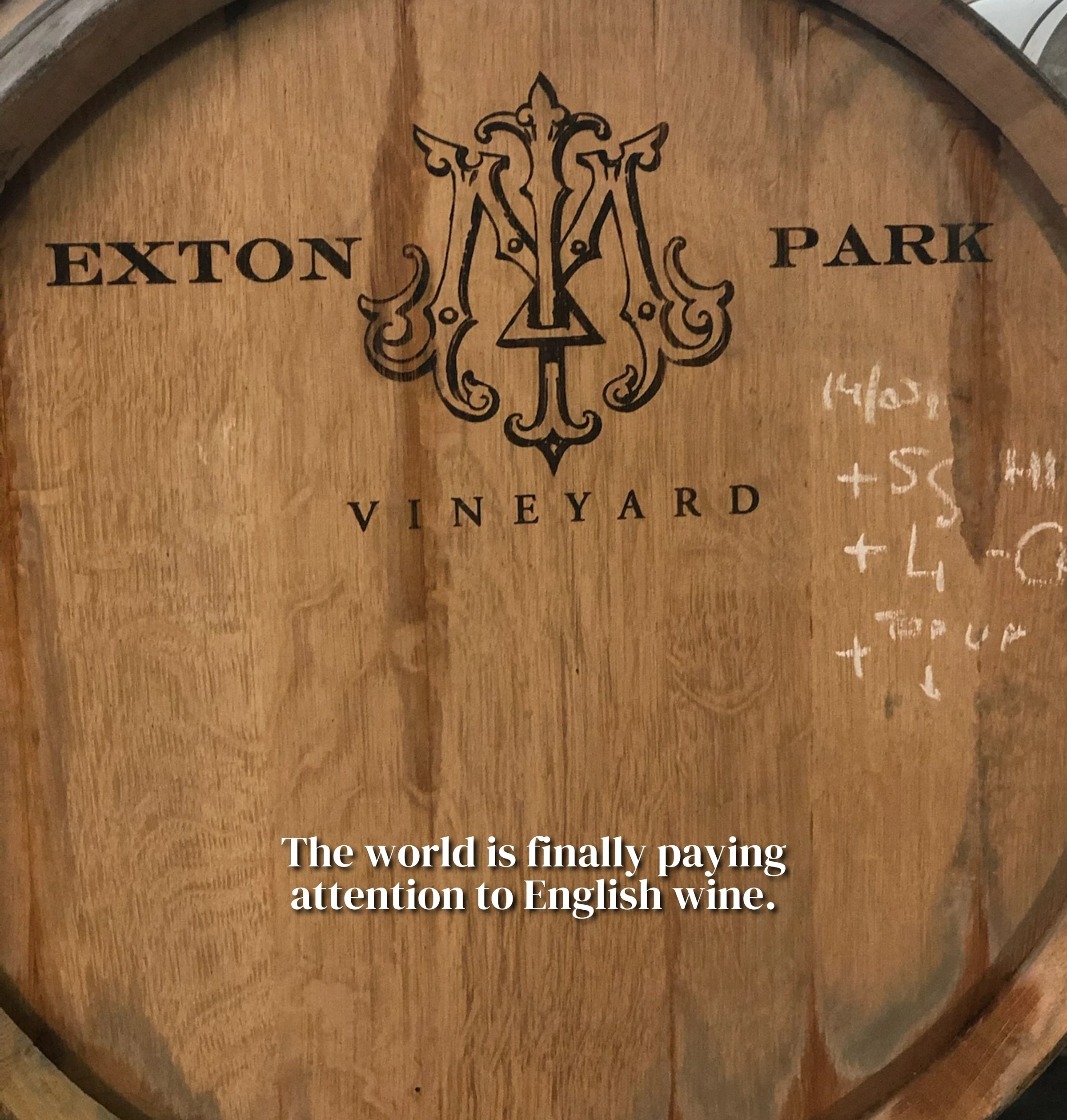 Oak wine barrel marked Exton Park Vineyard, with overlaid text about English wine