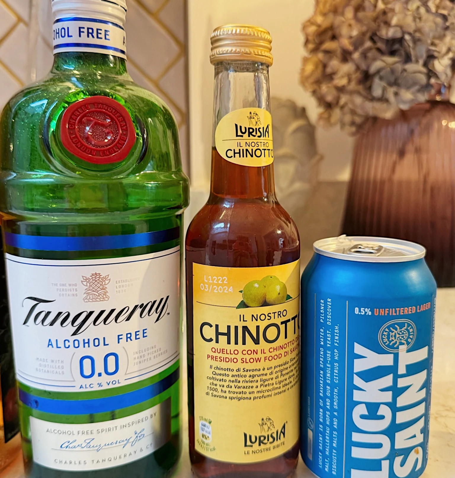 Three alcohol-free drinks, including Tanqueray 0.0, Lurisin Chinotto and Lucky Saint lager