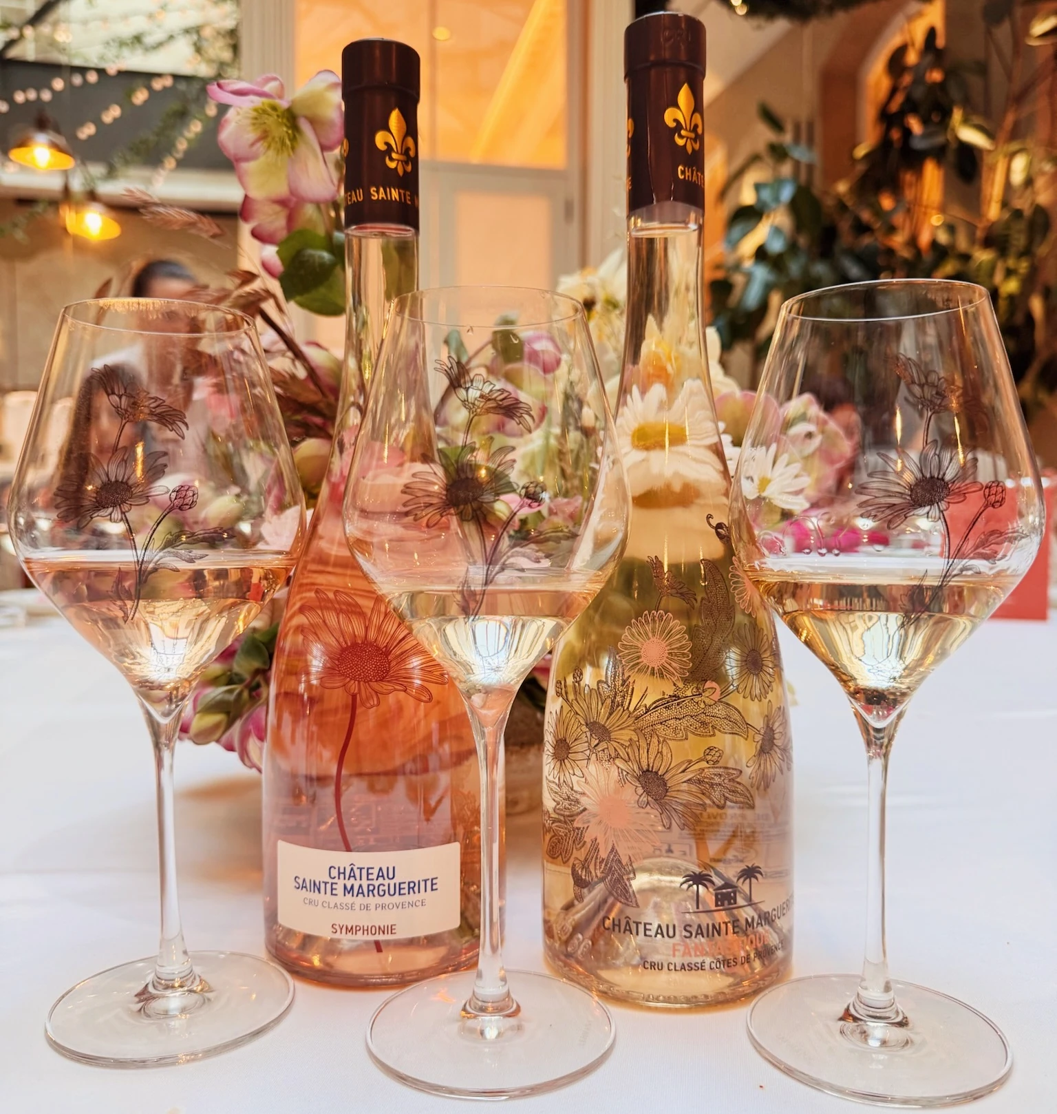Château Sainte Marguerite rosé wines and floral wine glasses on a decorated table