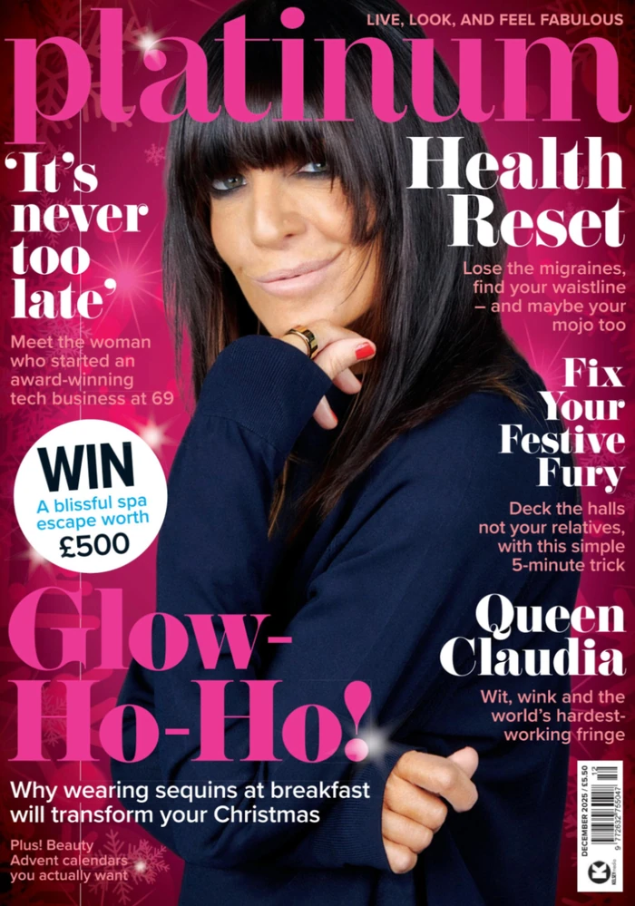 Magazine cover featuring woman with dark hair on pink background