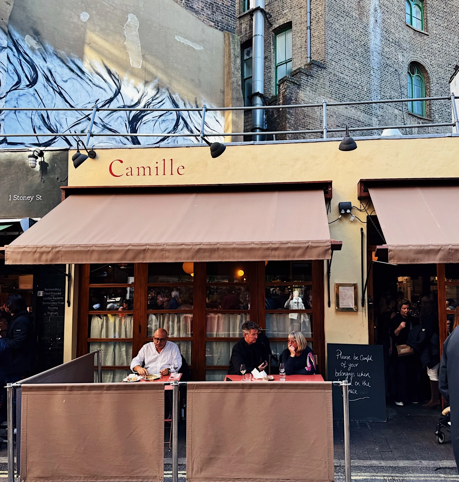 Camille restaurant frontage at 1 Stoney Street, with diners seated outside
