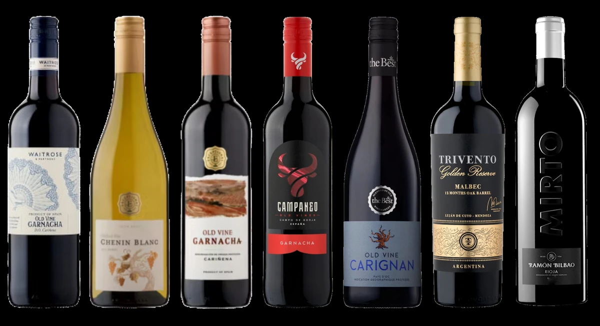 Seven wine bottles displayed against a black background