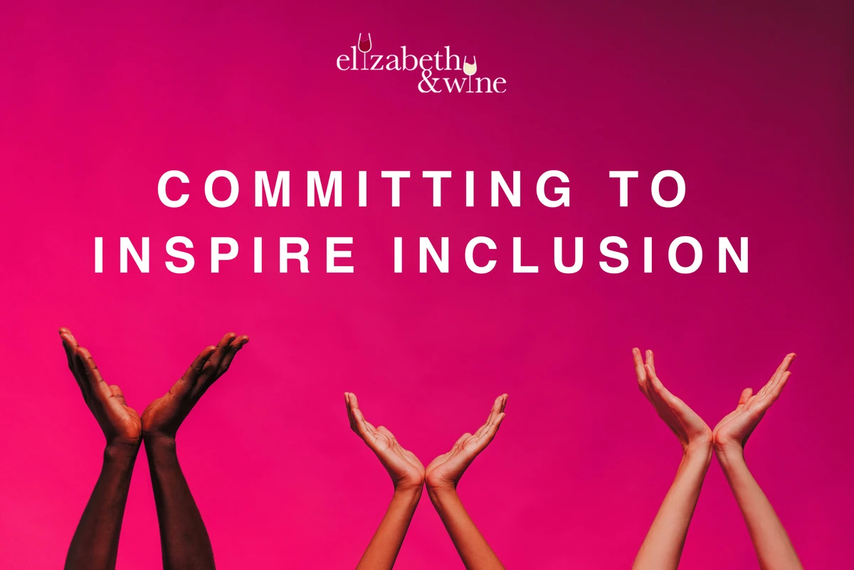 Elizabeth & Wine: Committing to Inspire Inclusion, with three pairs of raised hands