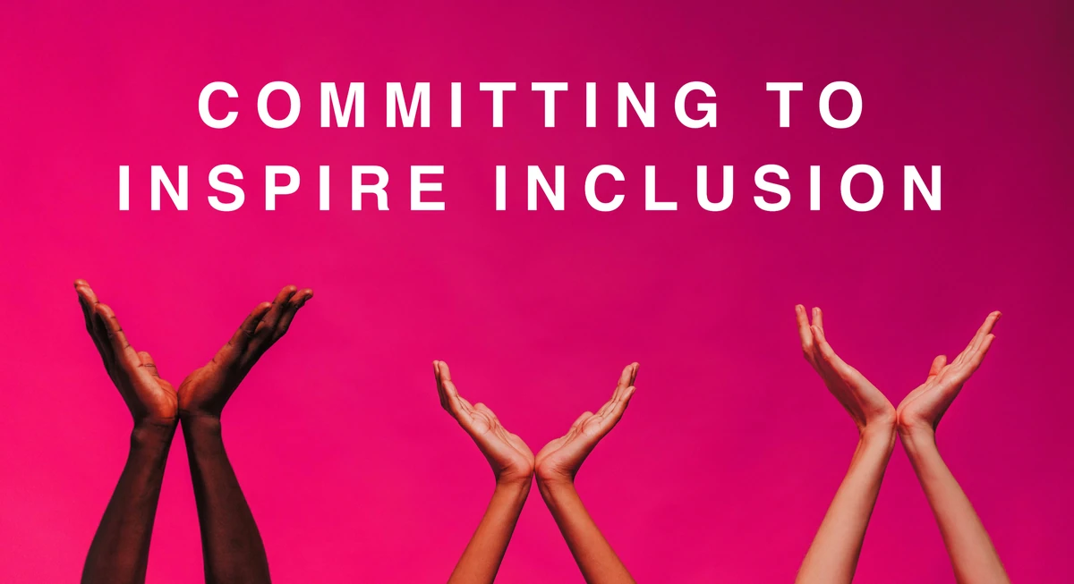 COMMITTING TO INSPIRE INCLUSION with three pairs of raised hands against pink background