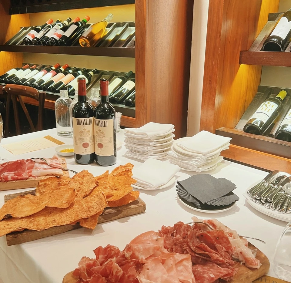 Wine, cured meats and Italian sharing plates on a table at Café Murano