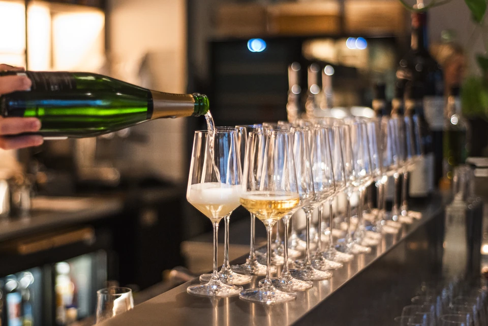 Sparkling wine being poured into glasses at Stem + Stem