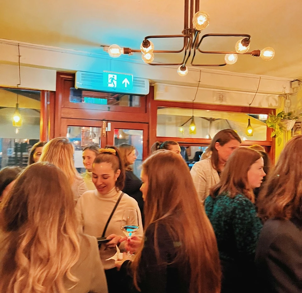 Guests mingle at a Furmint wine event