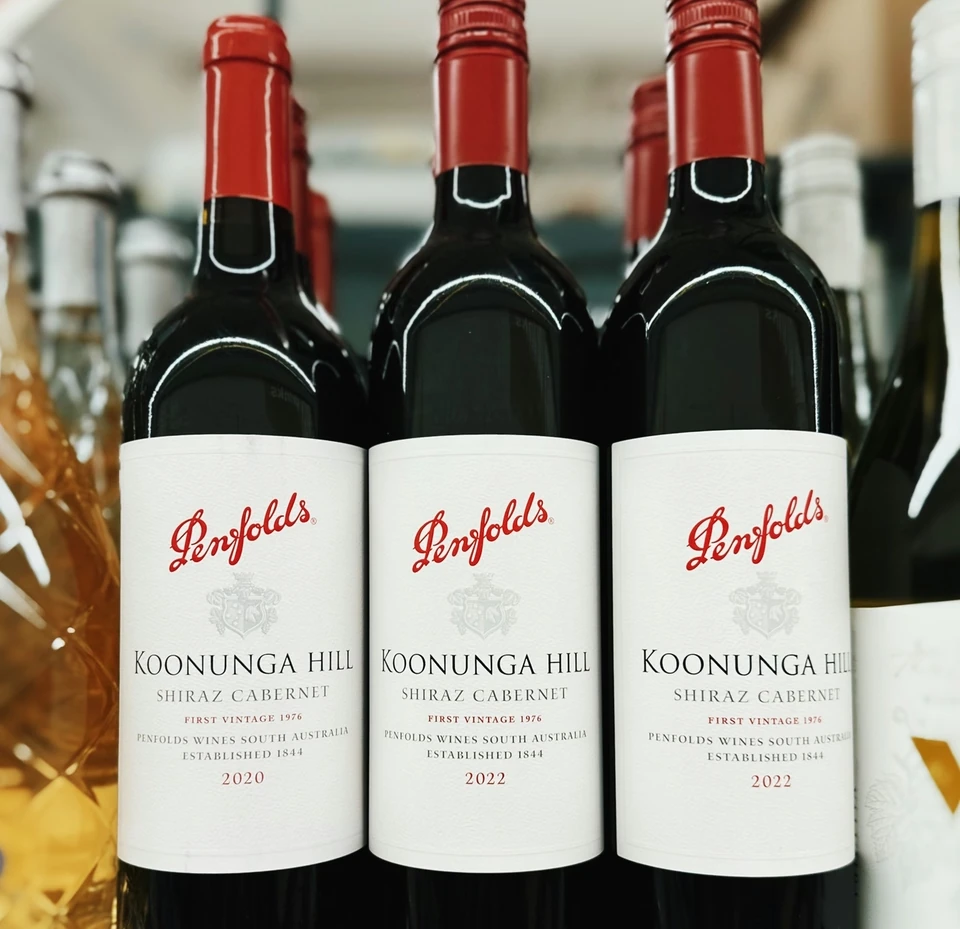 Three Penfolds Koonunga Hill Shiraz Cabernet bottles from 2020 and 2022