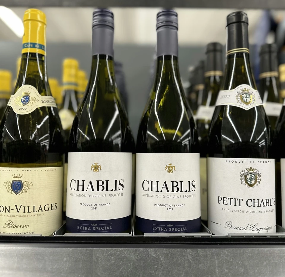 Chablis and Petit Chablis bottles displayed on an Asda supermarket shelf
