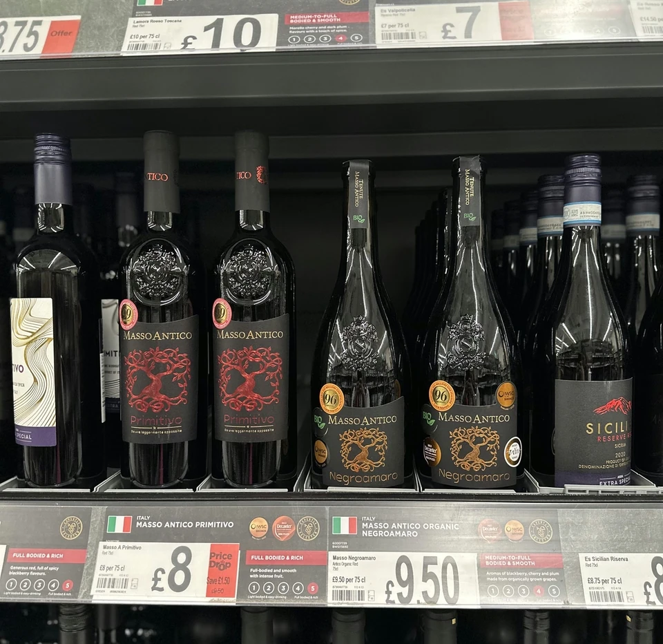 Masso Antico Primitivo and Negroamaro bottles on an ASDA wine shelf