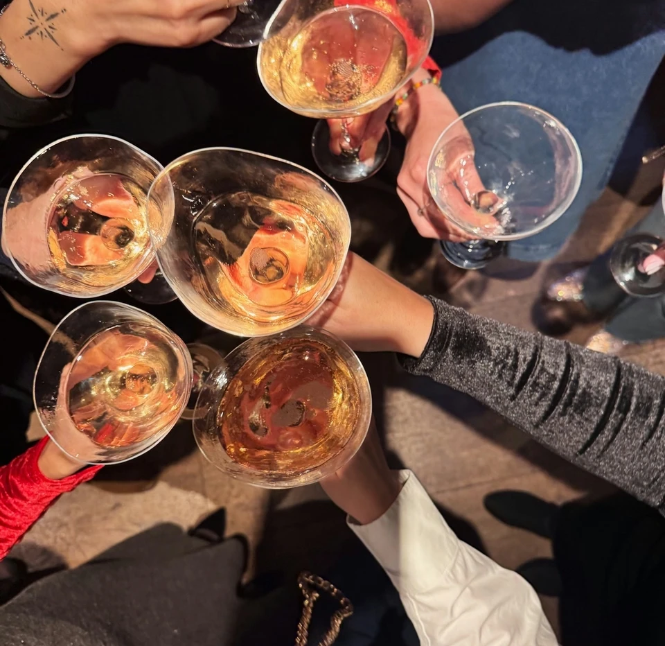 Guests raise glasses of sparkling wine during a Folc tasting