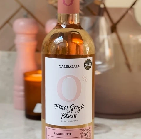 Bottle of Cambalala alcohol-free Pinot Grigio Blush on a marble surface