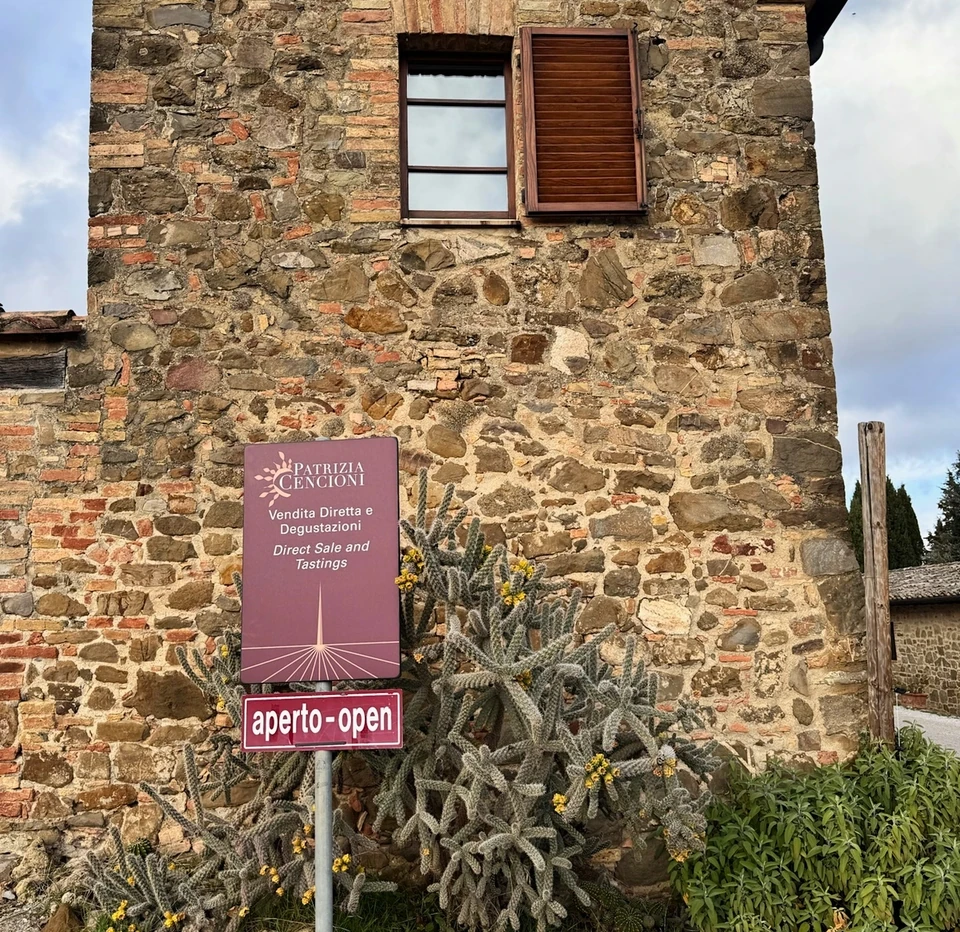 Stone winery building with a sign for Patrizia Cencioni direct sales and tastings