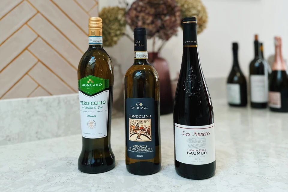 Three wine bottles: Moncaro Verdicchio, Teruzzi Rondolino and Les Nivières Cabernet Franc Saumur