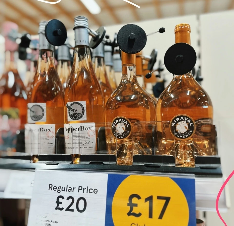 Rosé wine bottles on a Tesco supermarket shelf with a £17 Clubcard price sign