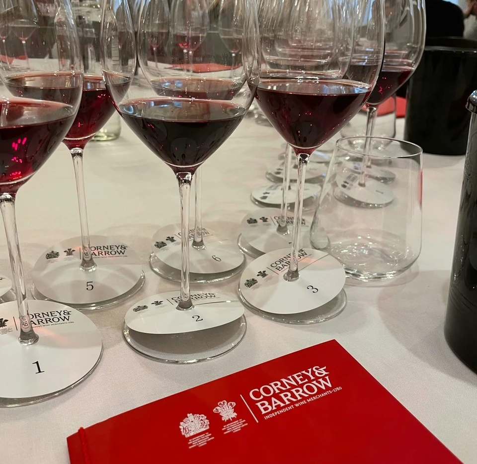 Numbered glasses of red wine at a Corney & Barrow tasting